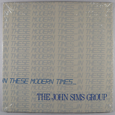 SIMS john GROUP – In these modern times