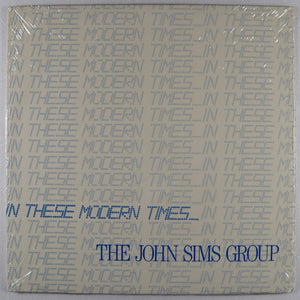 SIMS john GROUP – In these modern times